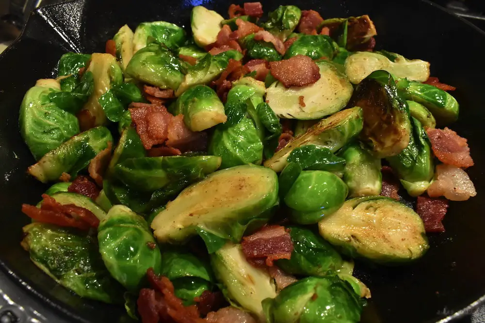 Brussels sprouts and bacon in frying pan