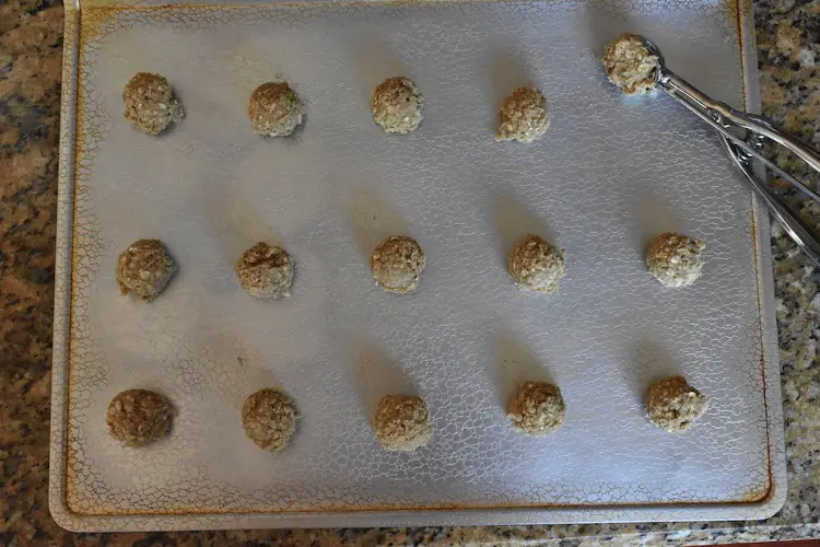 Oatmeal cookies dropped on cooking sheet