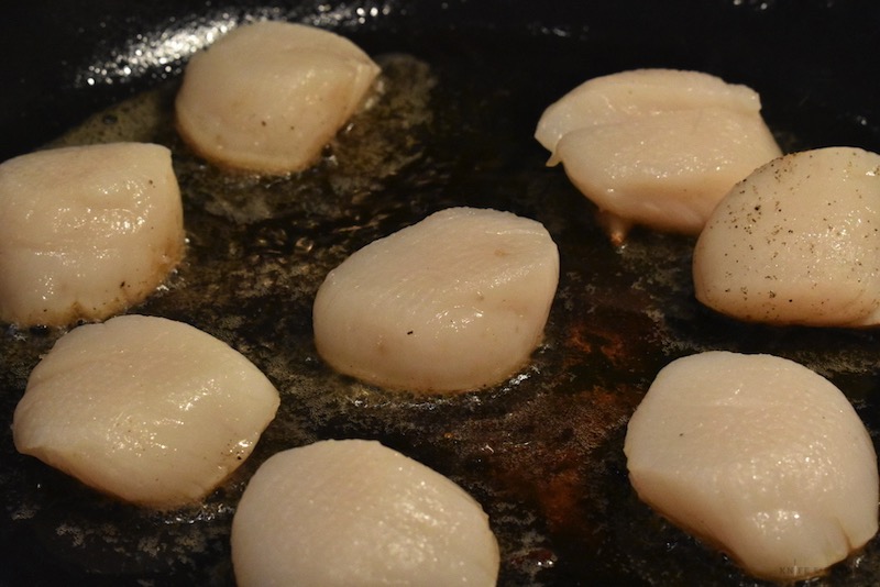 scallops frying in pan