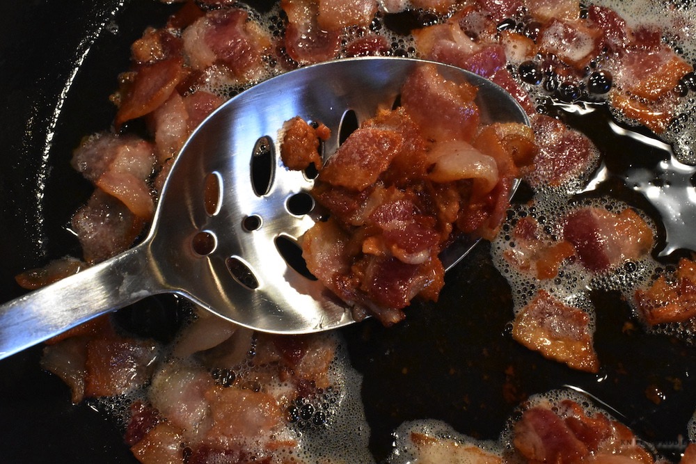 cut bacon in frying pan