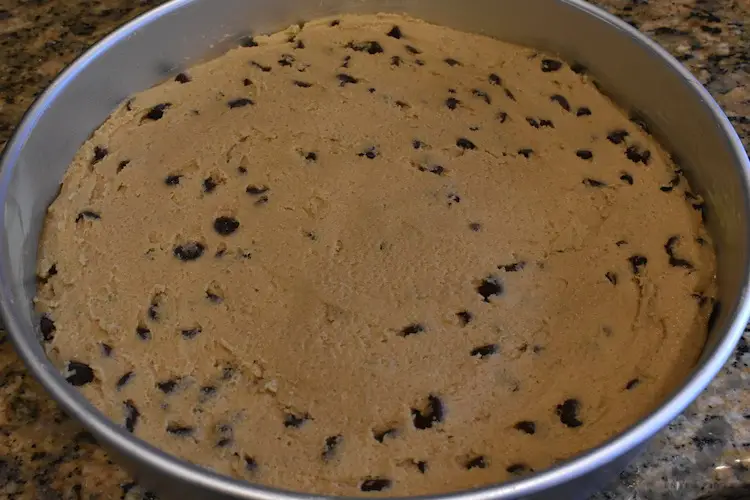 Chocolate chip cookie batter in the pan
