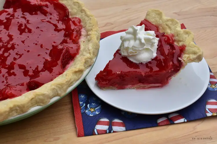 Fresh strawberry pie with whipped cream for Fourth of July