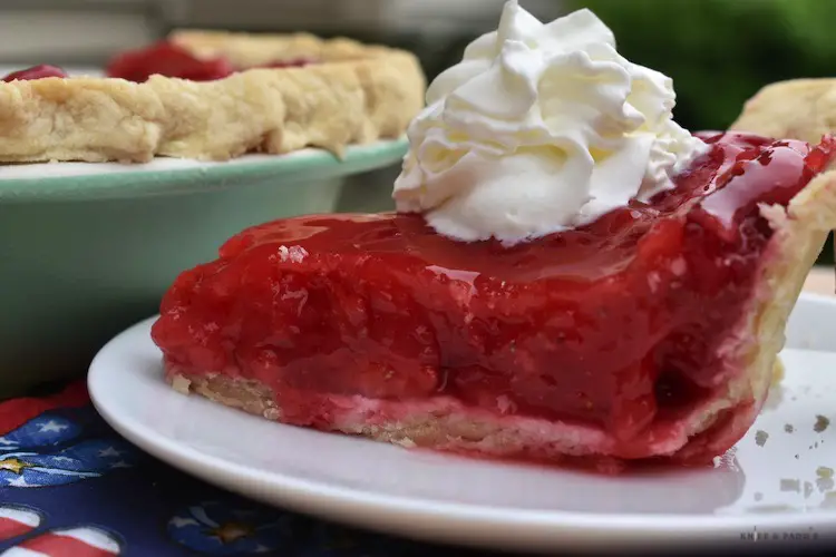Fresh strawberry pie with whipped cream