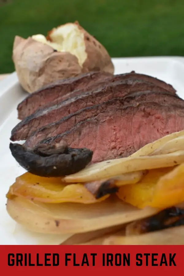 Steak, grilled onions and baked potato