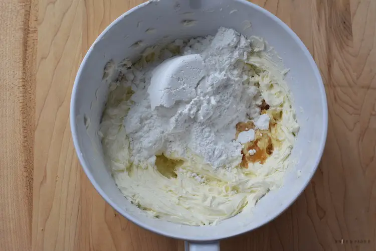 Putting ingredients into a mixing bowl