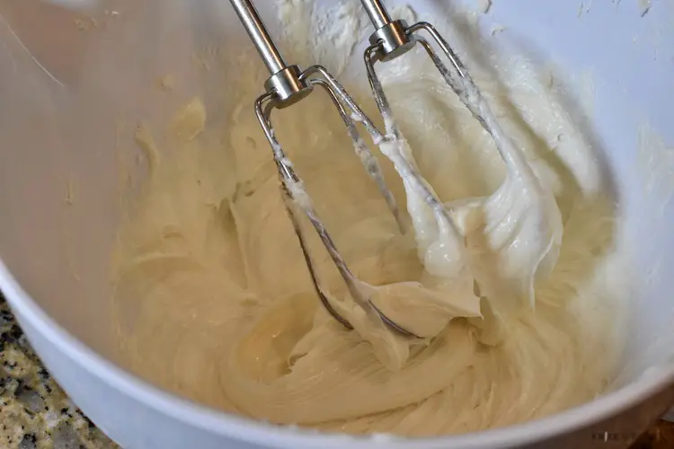 Vanilla and almond extracts added to the cream cheese