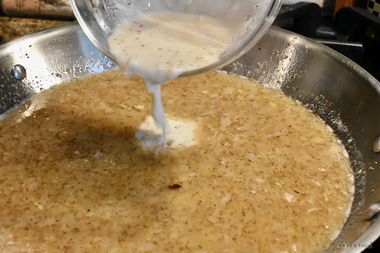 Adding the flour to the dressing for the German potato salad