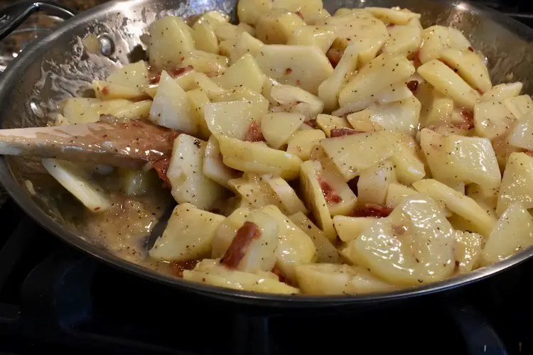 Putting the German potato salad in the frying pan