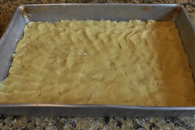 Cookie dough pressed in pan