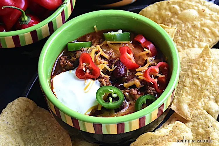 chili in a bowl with tortilla chips