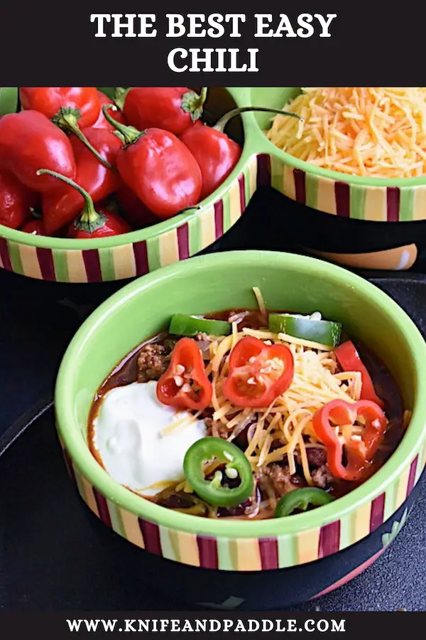 Ground beef, beans , cheese,peppers and sour cream in a bowl