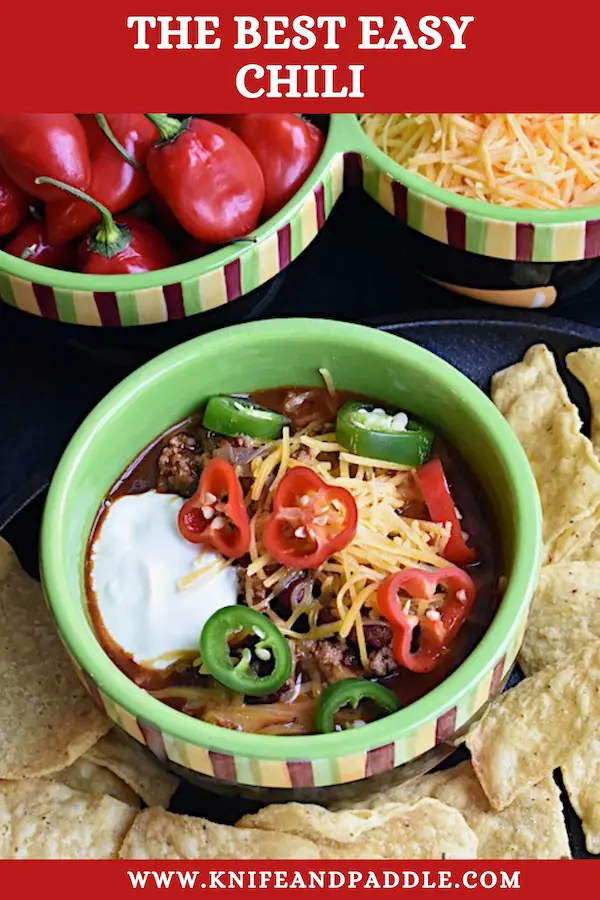 Ground beef, beans , cheese,peppers and sour cream in a bowl