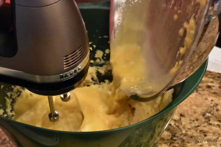 Whipping potatoes with cheese mixture