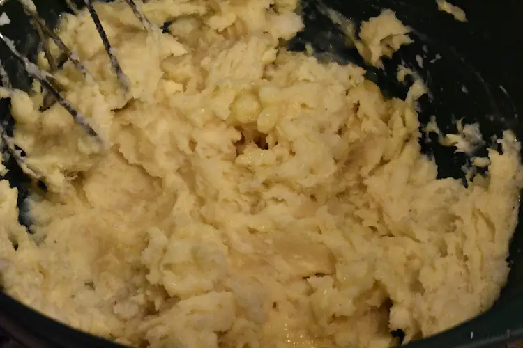 Whipping potatoes with cheese mixture