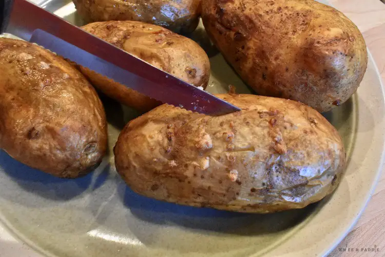 Cutting the baked potato