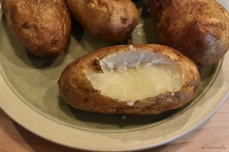 Cutting an oval top out of the baked potato