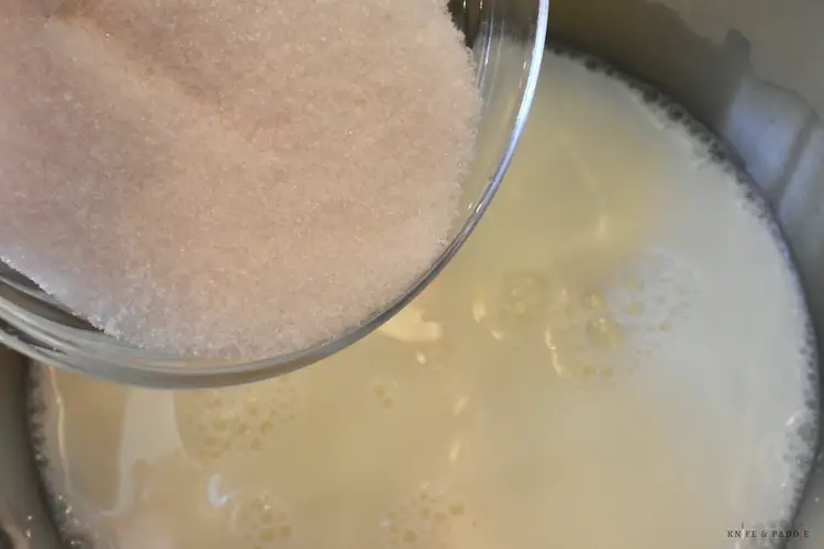 Milk and sugar in a stove top pan