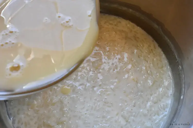 Adding the egg mixture to the rice pudding