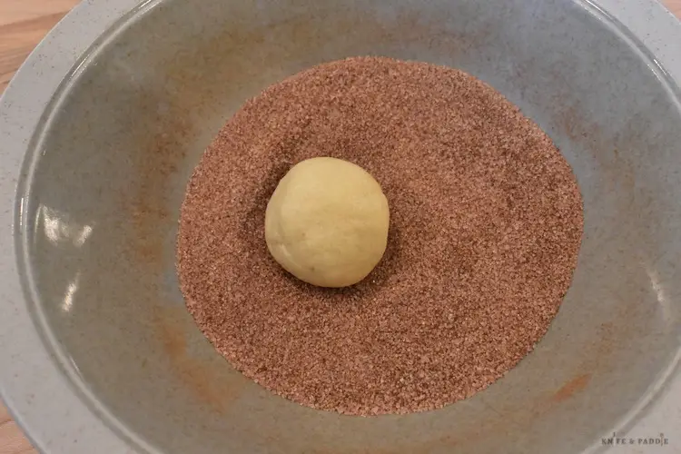 Dough ball rolled into the cinnamon/sugar topping