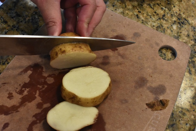 Slicing potato into rounds
