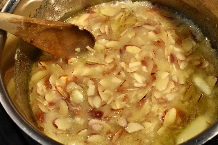 Melted utter, sugar and almonds in a large saucepan