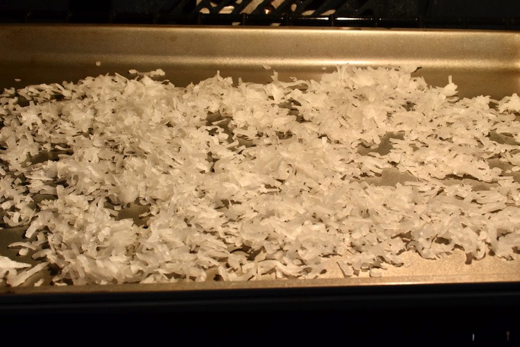 Coconut spread evenly on a baking sheet in a 350 degree preheated oven 