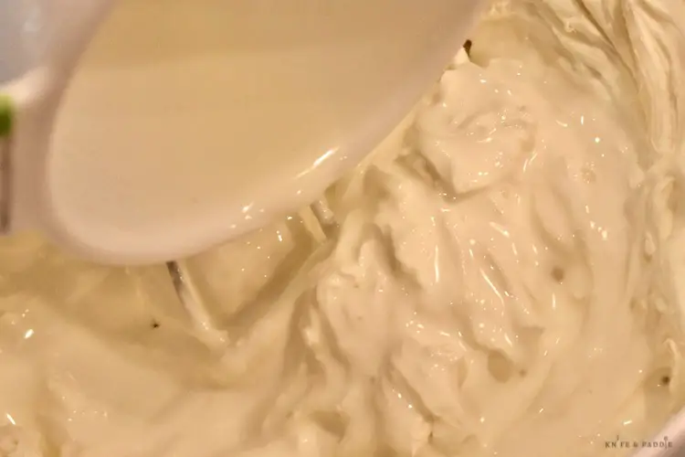 Cream cheese, mascarpone cheese pure vanilla extract, confectioners' sugar and heavy whipping cream beaten together