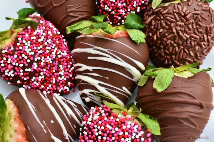 Chocolate covered strawberries with drizzled chocolate, nonpareils, chocolate sprinkles