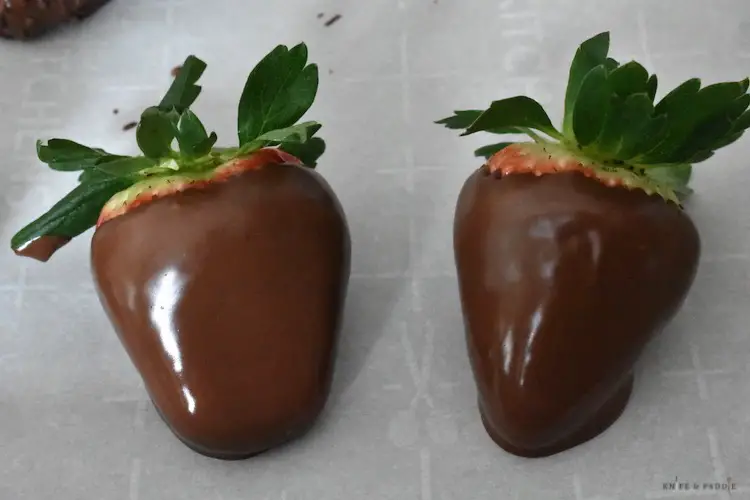 Dipped strawberries on parchment paper