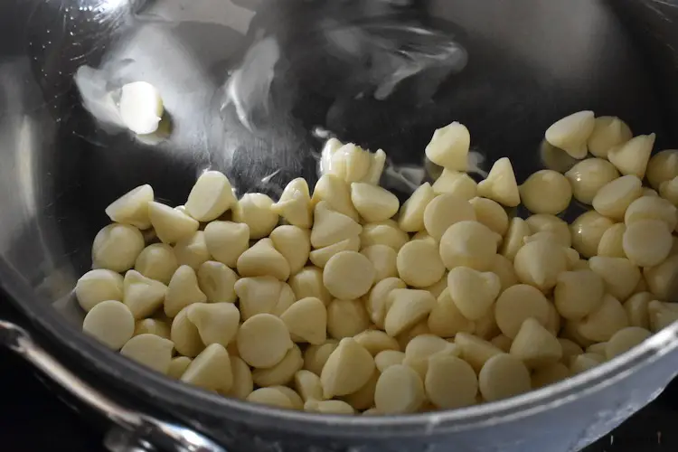 White chocolate chips in a saucepan