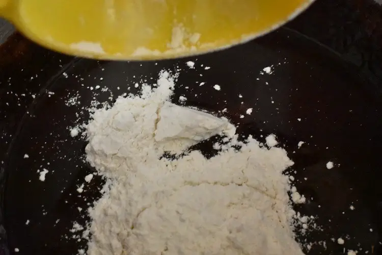 Adding flour to the batter