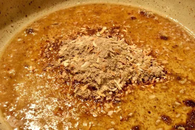 Adding Lipton onion soup mix into the skilled