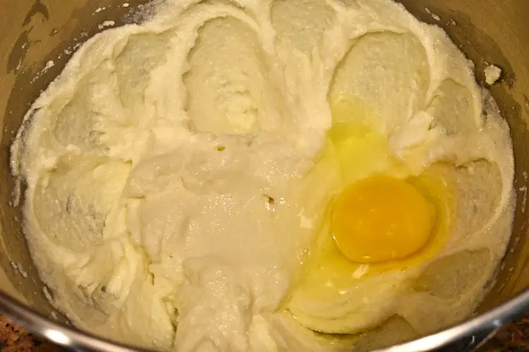 ricotta, sugar and egg in a mixing bowl