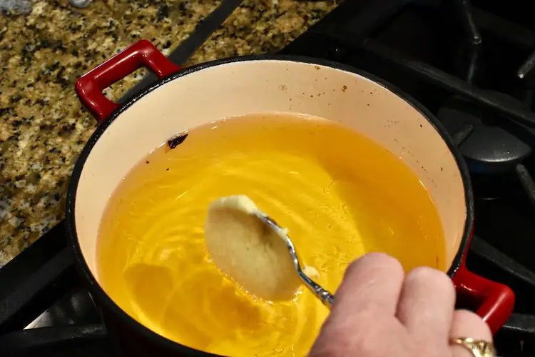 Spooning the batter, dropping into the heated oil