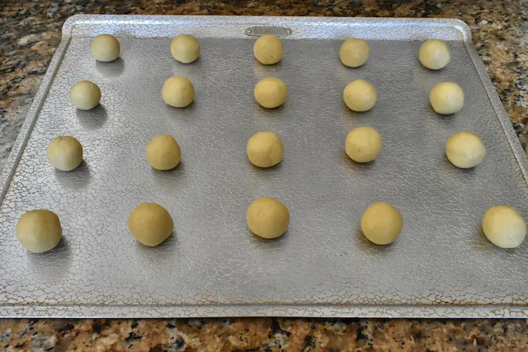 Rolled dough balls on a baking sheet