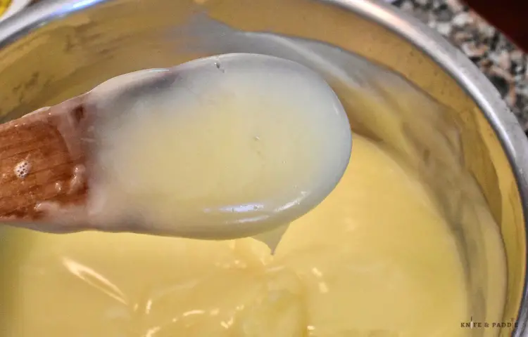 Thickened vanilla pudding in a sauce pan