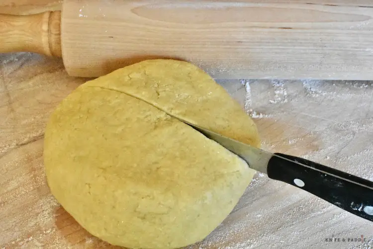 Pie dough on a wooden board 