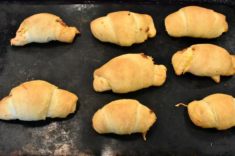 baked bacon egg and cheese crescent rolls on baking sheeet