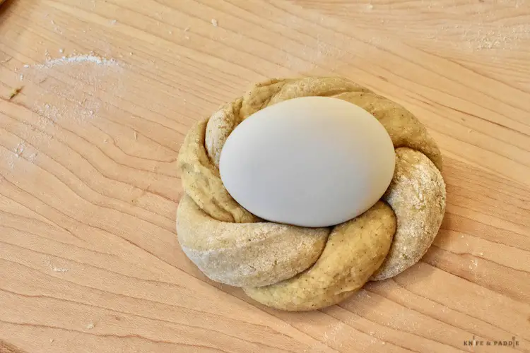 Rope rolled into a circle with a hard boiled egg placed on top