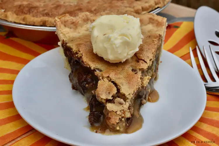 Simple Kentucky Derby Pie with ice cream on a plate