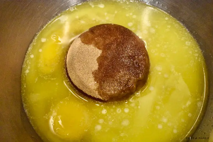 Melted butter, eggs, brown sugar, sugar, vanilla in a mixing bowl  