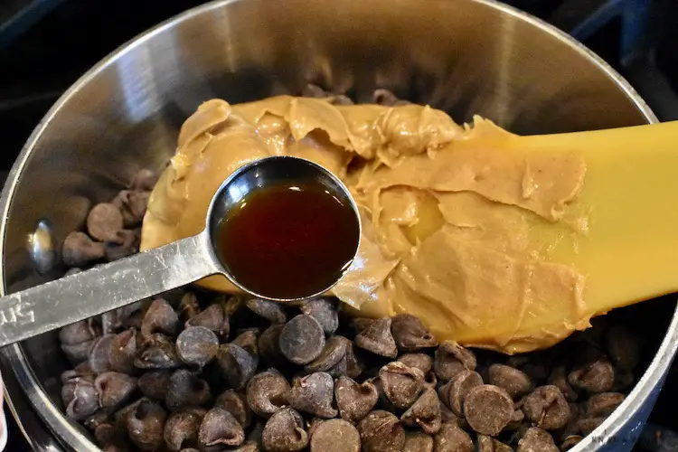 Melting chocolate chips, peanut butter and vanilla in a small sauce pan