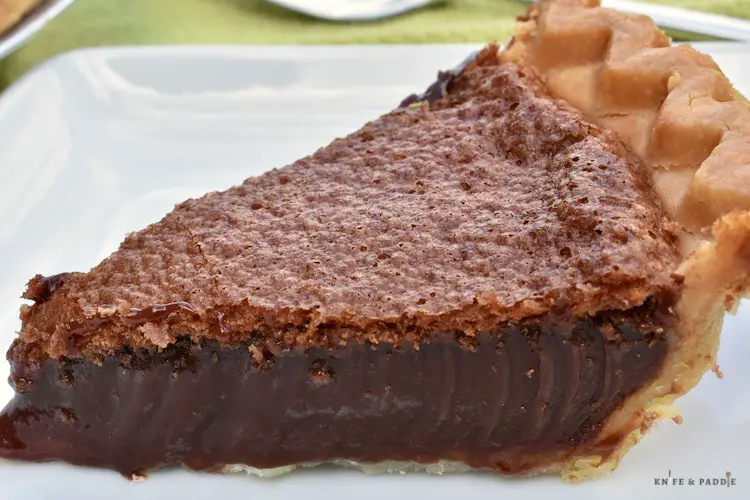 Slice of chocolate chess pie plated