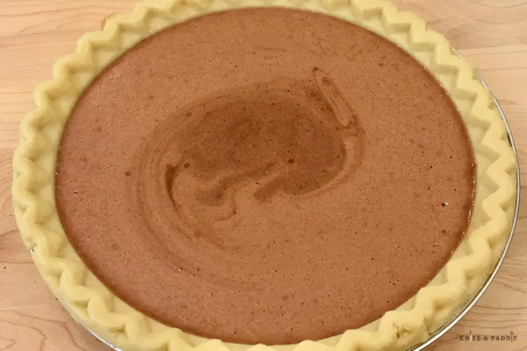 Chocolate Pie filling poured in an unbaked pie shell