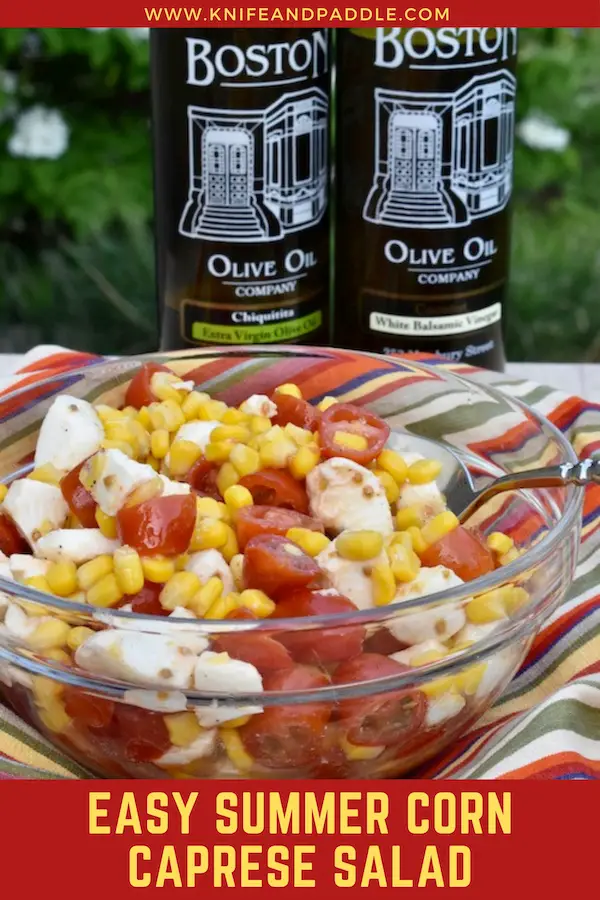 Corn caprese salad in a bowl with olive oil and balsamic vingear