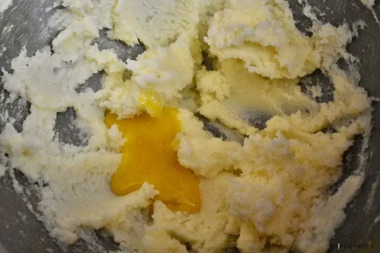 Creamed butter and sugar with egg yolk in a mixing bowl