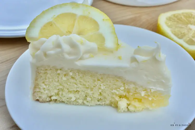 Light Lemon Cake with Cream Cheese Frosting sliced and plated