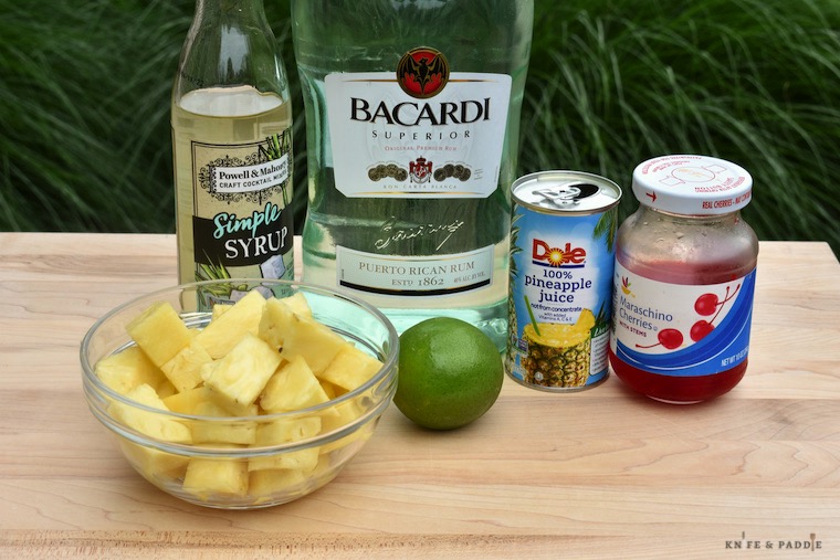 Simple syrup, white rum, pineapple juice, maraschino cherries, lime, pineapple