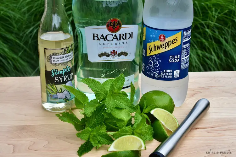 Ingredients:  simple syrup, white rum, club soda, fresh mint, fresh lime and a muddler