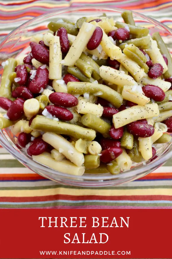 Kidney, green and wax beans with diced Vidalia onion in a bowl